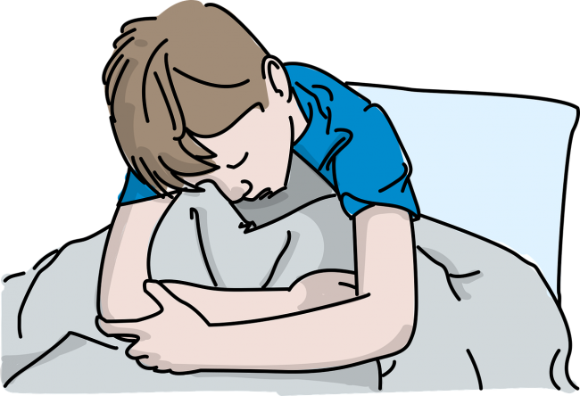 Cartoon of a boy in bed