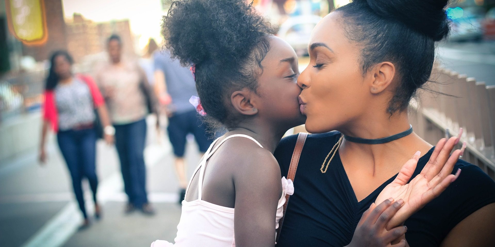 Mother and daughter embrace.